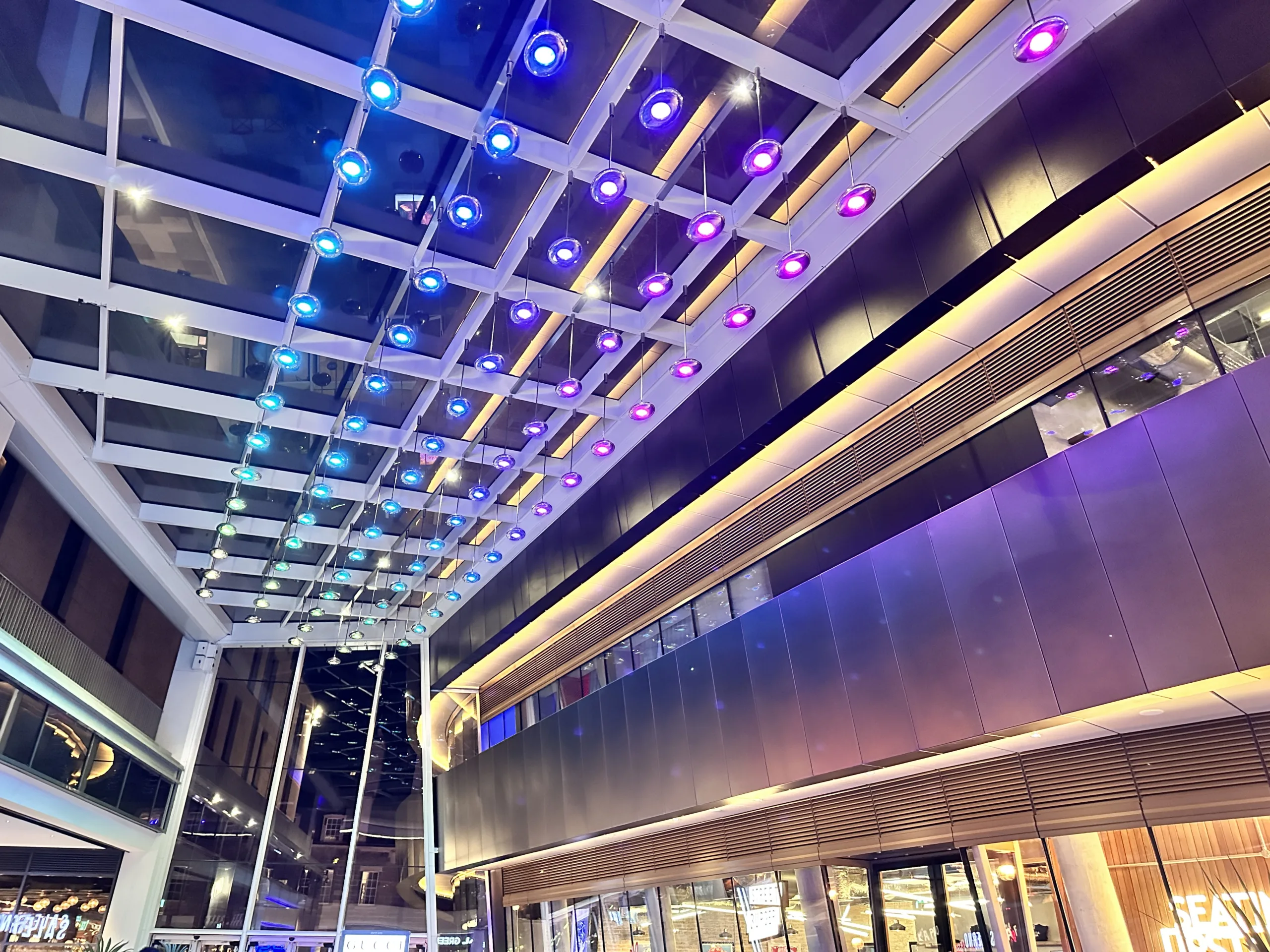 St James Quarter, Edinburgh | Bespoke retail lighting | custom illuminated ceiling pendants | The Light Lab