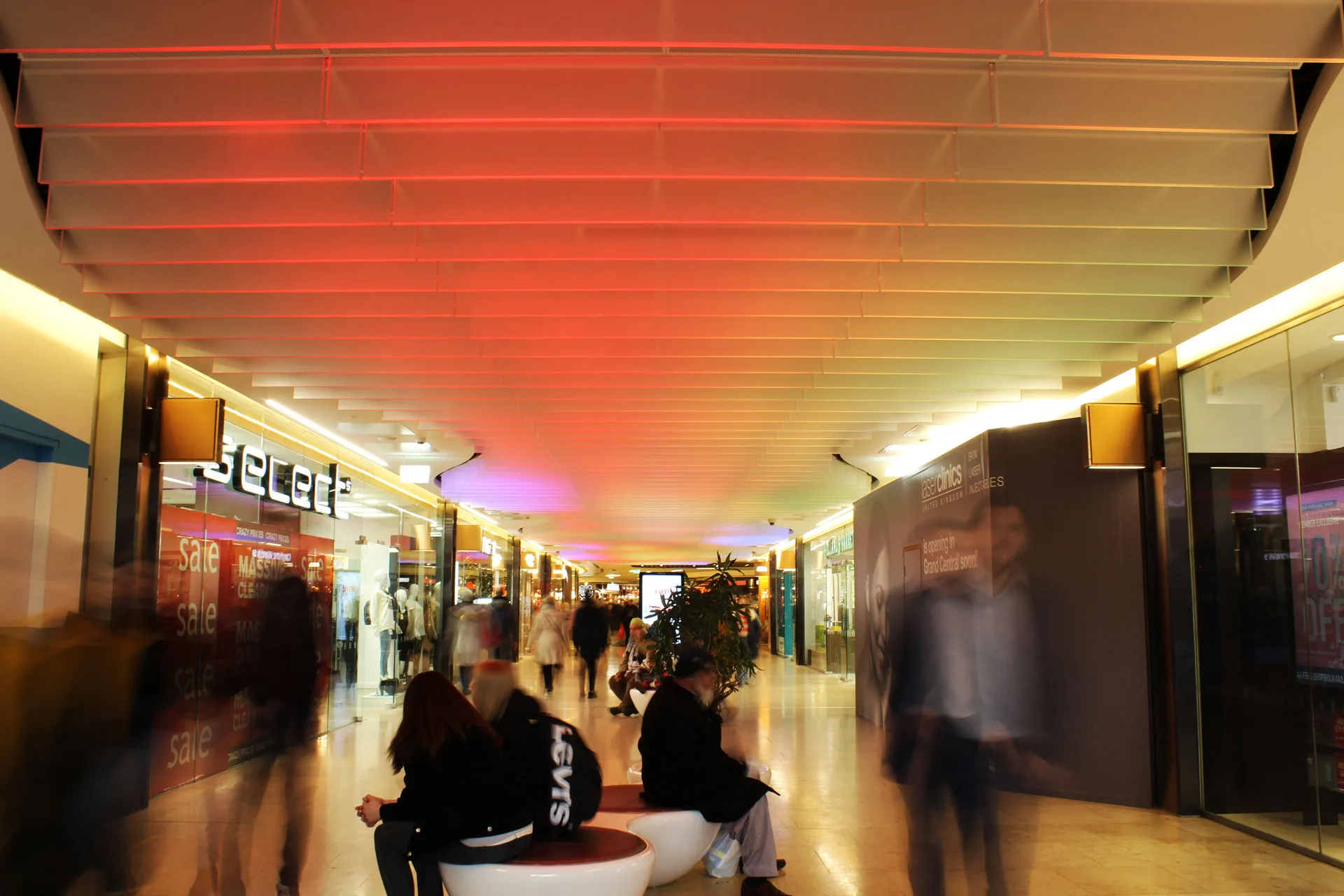 The Light Lab | retail lighting | bespoke spectraglass ceiling fins | edge llit glass | grand central birmingham