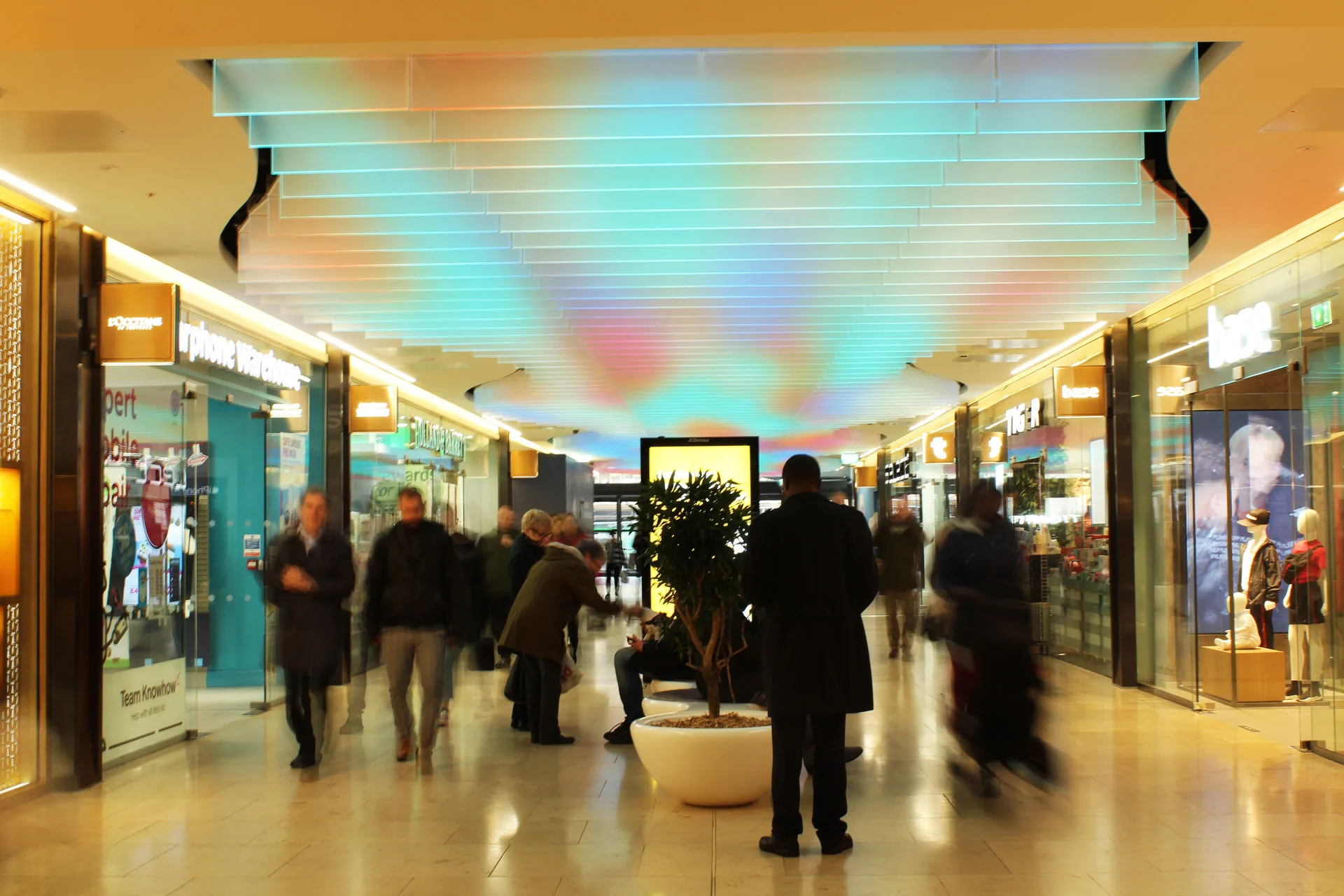 The Light Lab | retail lighting | bespoke spectraglass ceiling fins | edge llit glass | grand central birmingham