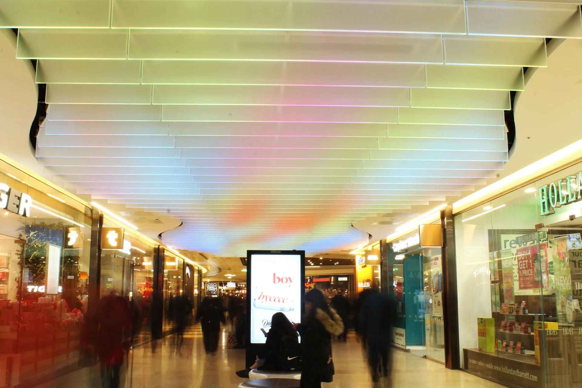 The Light Lab | retail lighting | bespoke spectraglass ceiling fins | edge llit glass | grand central birmingham